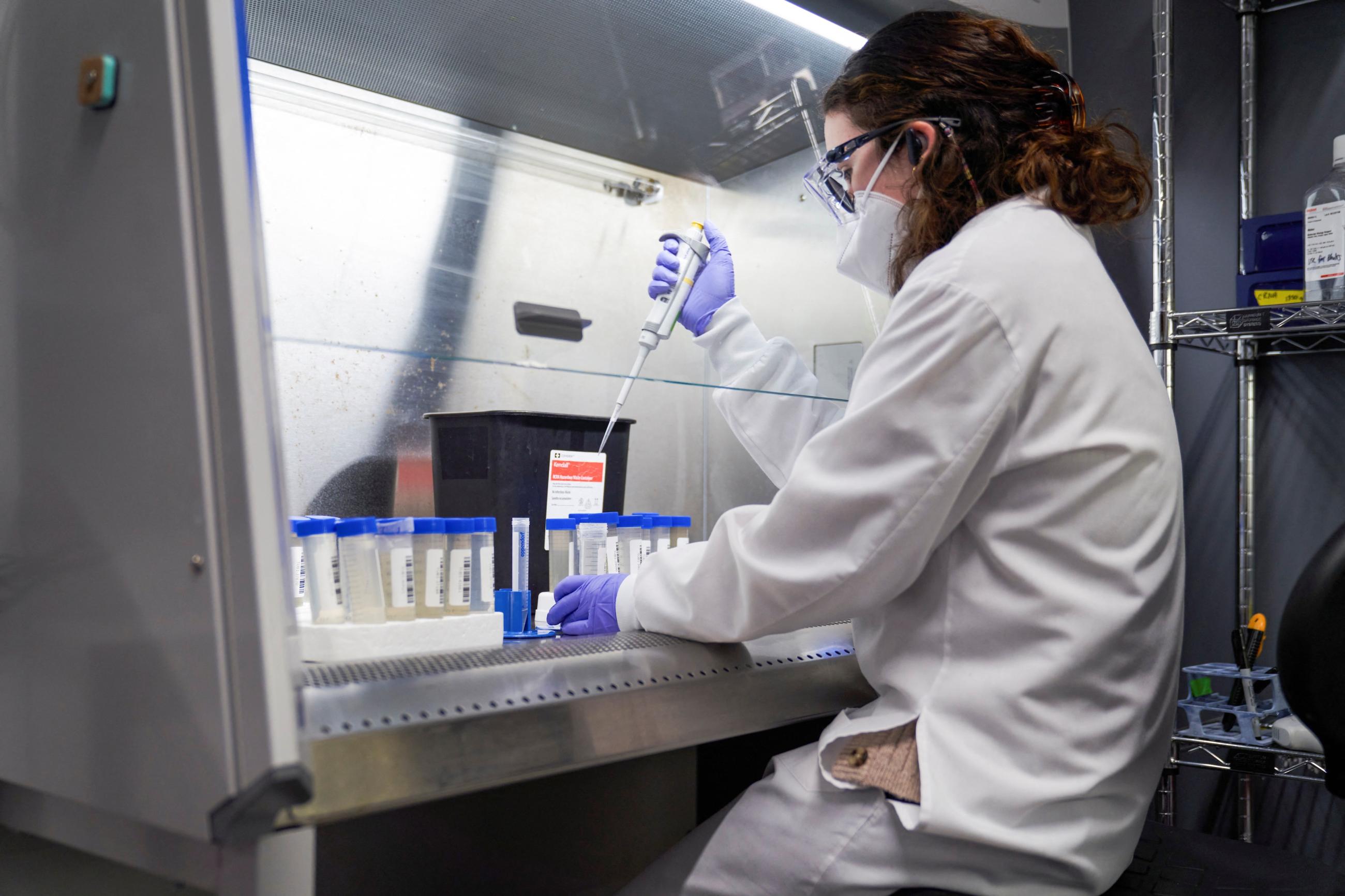 A lab technician tests wastewater samples from around the United States for the coronavirus disease (COVID-19) at the Biobot Analytics, in Cambridge, Massachusetts, February 22, 2022.