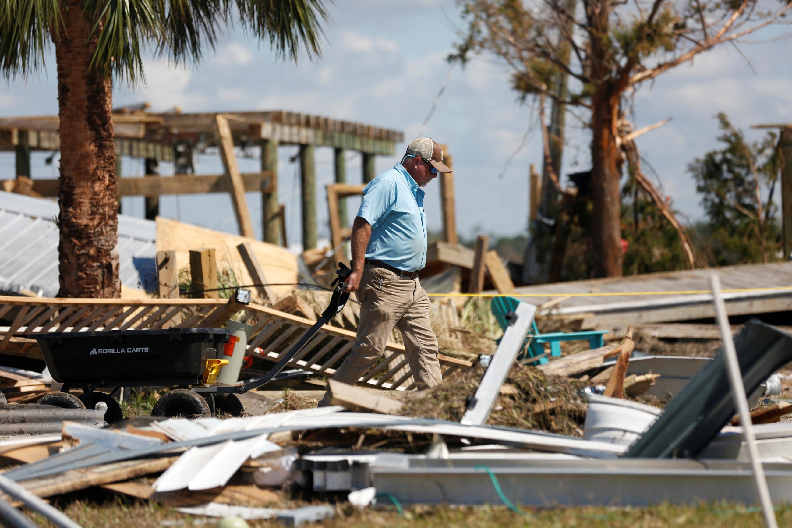A resident of Keaton Beach works to recover their belongings from their home after Hurricane Helene passed through the Florida panhandle.