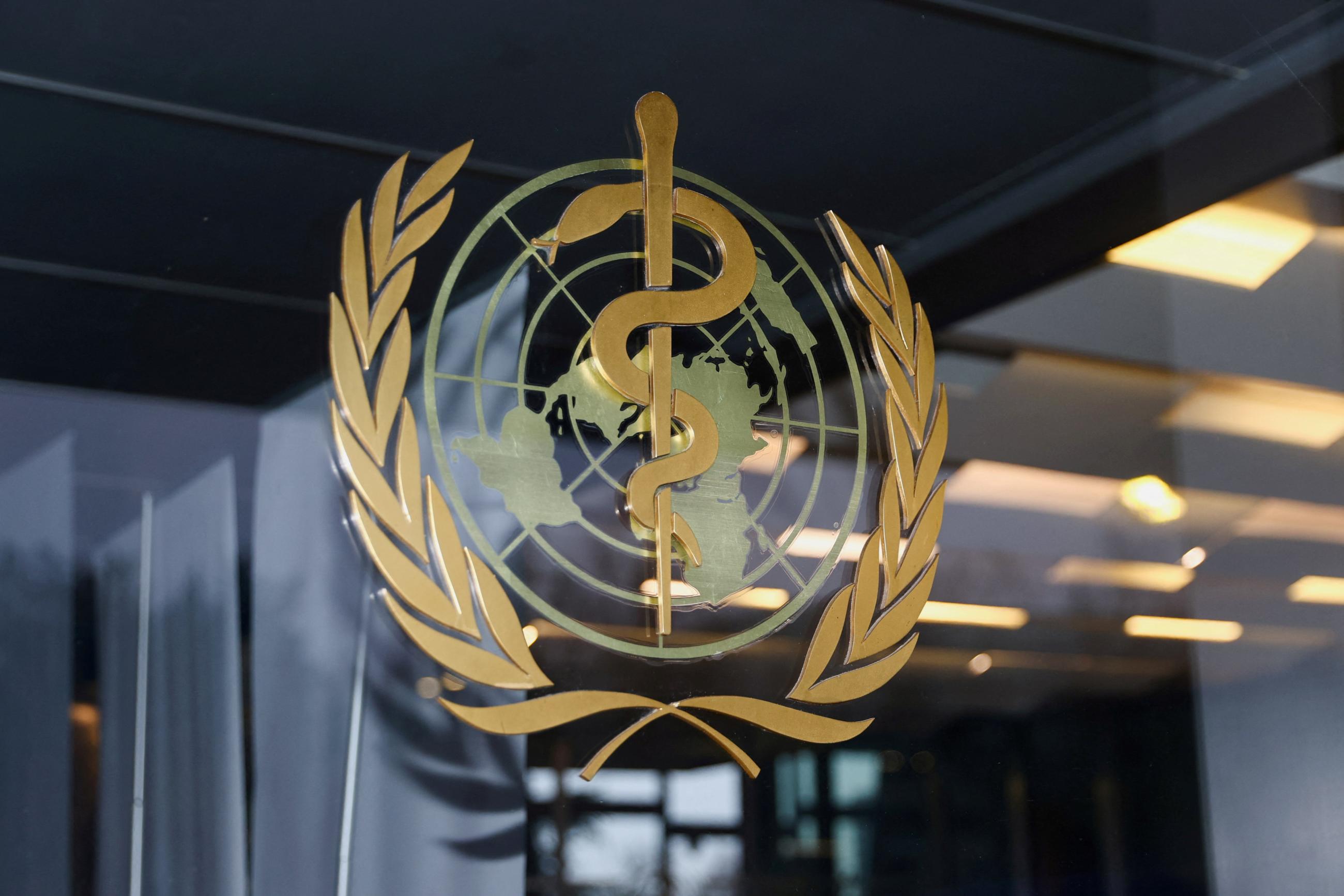 The World Health Organization (WHO) logo is pictured at the entrance of the WHO building, in Geneva, Switzerland, on December 20, 2021.