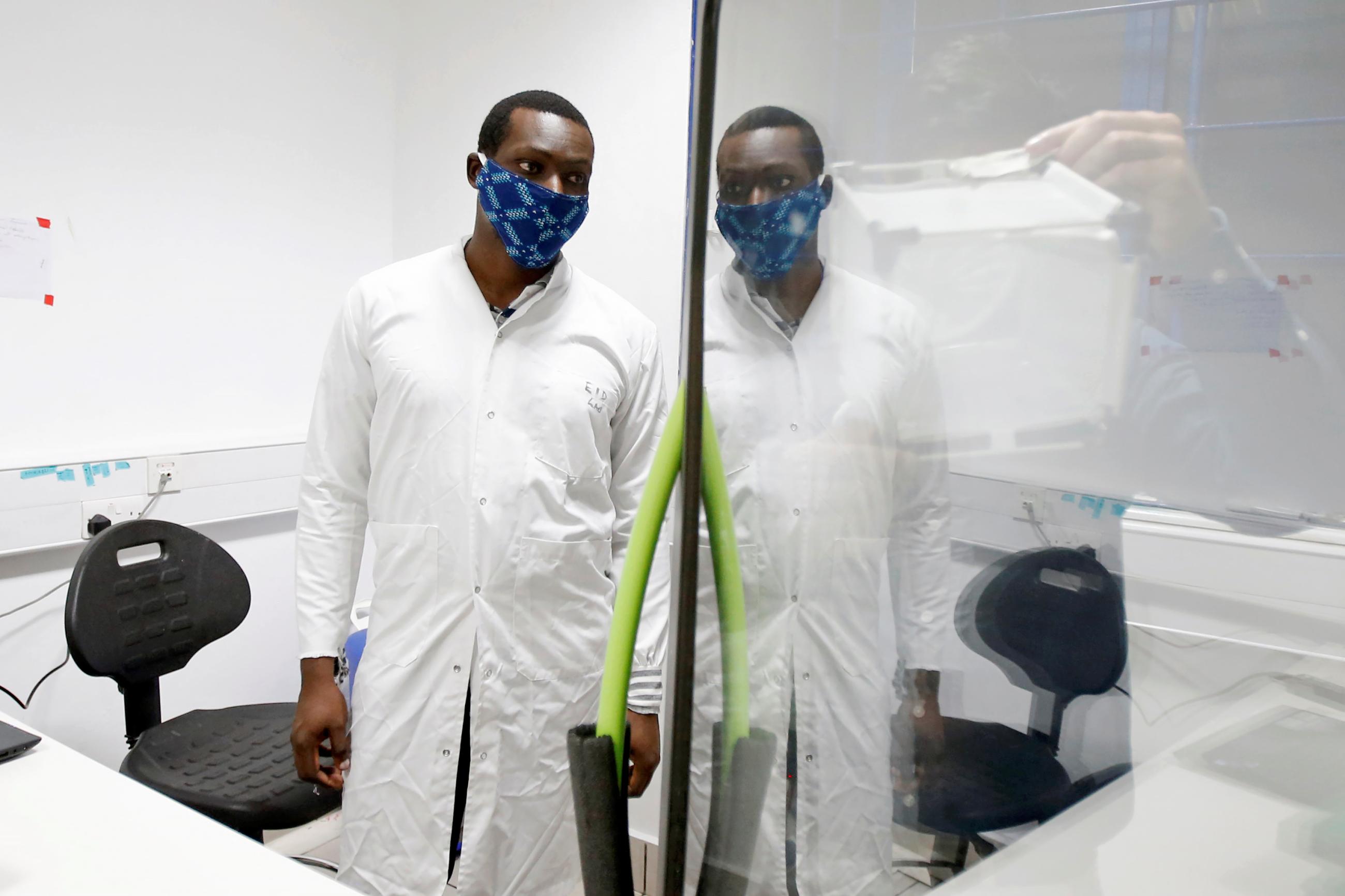Researchers work on a microbe they say can protect mosquitoes from malaria, at the International Centre of Insect Physiology and Ecology headquarters, in Nairobi, Kenya on, May 11, 2020. 