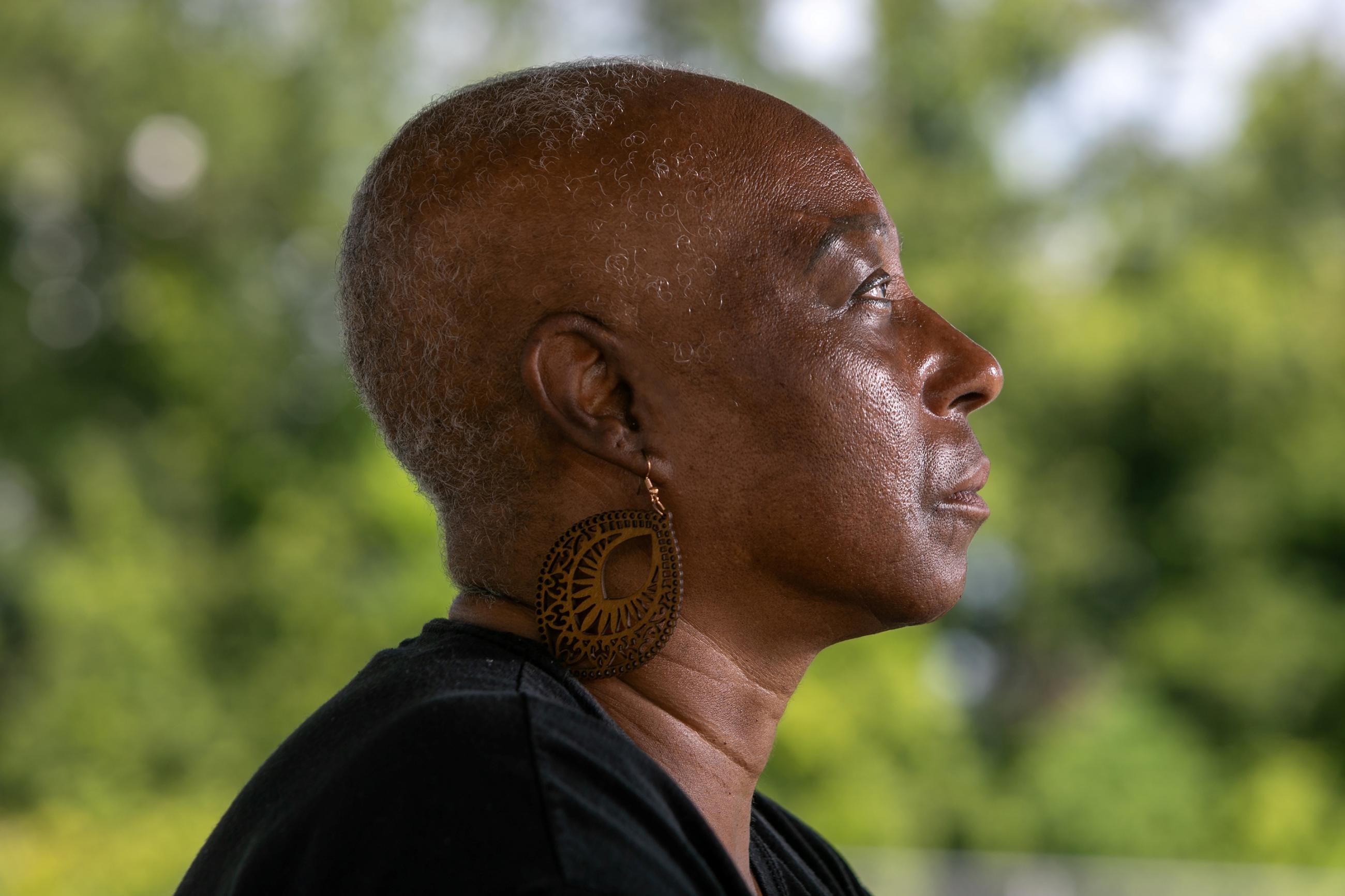 Veronica Jones, a survivor of aggressive breast cancer walks her neighborhood, in Convent, Louisiana, on Thursday June 26, 2025.