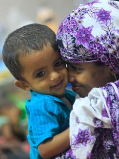 A mother plays with her thirteen-month old child Neerob, who is suffering from diarrhoea, at the International Centre for Diarrhoeal Disease & Research (ICDDRB), in Dhaka April 6, 2012. 