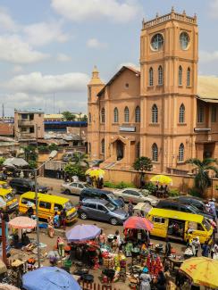 The picture shows a market bustling with trade. 