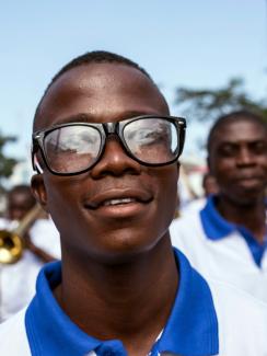  Picture shows Musa smiling at the camera as he walks in the parade. 