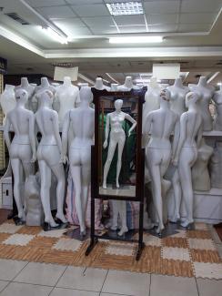  This is a powerful photo of an intriguing subject matter—a bunch of mannequins stacked up in the middle of a corridor. 