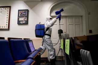 The White House press briefing room is cleaned on the evening U.S. President Donald Trump returns from Walter Reed Medical Center after contracting COVID-19, in Washington, DC, October 5, 2020