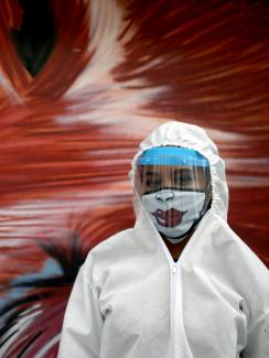 A city employee wearing protective gear poses for a photo during a citywide personal care day, amid the coronavirus disease outbreak in Bogota, Colombia on April 17, 2020.