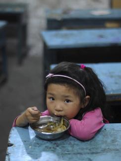A child eats her lunch in a classroom at a primary school in Hefei, Anhui Province, China on June 1, 2011.