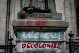 A vandalized statue of the Danish-Norwegian 18th century missionary Hans Egede is seen at the Marble Church (Frederik's Church), in Frederiksstaden, in Copenhagen, Denmark June 30, 2020. 