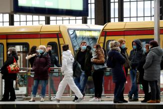 Passengers wear face masks as they wait for an S-Bahn commuter train on the platform at Friedrichstrasse station during lockdown amid the coronavirus disease (COVID-19) pandemic, in Berlin, Germany February 5, 2021.