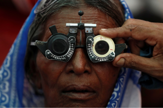A woman gets her eyes tested at a free eye-care camp in Mumbai, India on December 6, 2019.