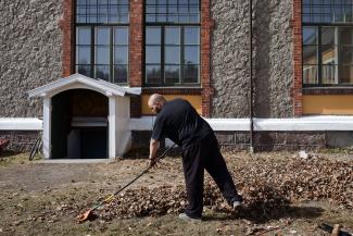 An inmate sentenced to ten months rakes leaves in Bastøy Prison in Horten, Norway on April 11, 2011. 