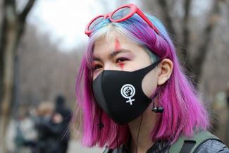 A demonstrator takes part in a march to mark International Women's Day in Almaty, Kazakhstan March 8, 2021. 