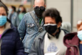 People arrive at the Javits Center mass vaccination location amid the coronavirus disease (COVID-19) pandemic in the Manhattan borough of New York City, New York, U.S., April 13, 2021.