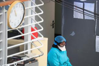 A health worker takes a break from her work at a temporary field hospital set up by Doctors Without Borders during the coronavirus disease on July 21, 2020.