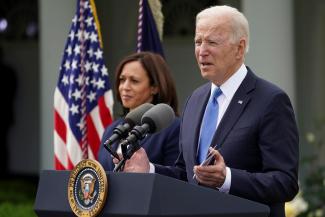  U.S. President Joe Biden, accompanied by Vice President Kamala Harris, speaks about the coronavirus disease (COVID-19) response and the vaccination program from the Rose Garden of the White House in Washington, U.S., May 13, 2021. 
