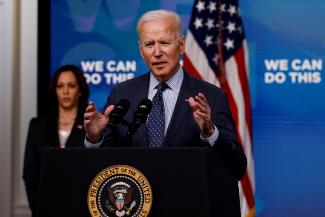 U.S. President Joe Biden delivers remarks on his administration's coronavirus disease (COVID-19) response, as Vice President Kamala Harris stands by in the Eisenhower Executive Office Building's South Court Auditorium at the White House in Washington, U.S., June 2, 2021.
