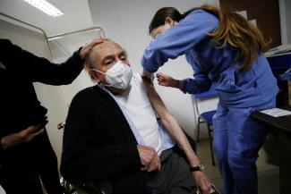 An elderly man receives an AstraZeneca COVID vaccine as Chile starts a booster campaign for those inoculated with the Sinovac vaccine. Photo taken on August 11, 2021.