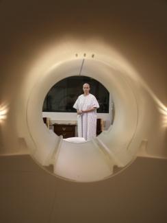 A cancer patient is seen through the tube of a MRI scanner as she prepares to enter the machine for an examination at Georgetown University Hospital in Washington, DC, on May 23, 2007.