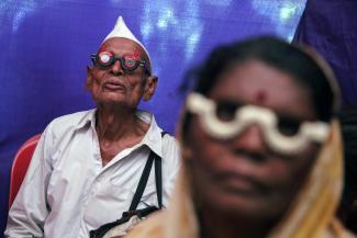People get their eyes tested at a free eye-care camp on the occasion of Indian politician Babasaheb Ambedkar's death anniversary in Mumbai December 6, 2014.