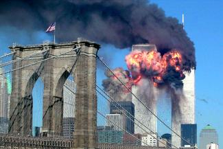 Both towers of the World Trade Center burn after being hit by planes in New York September 11, 2001.