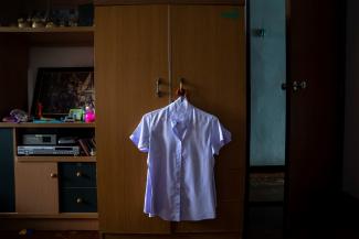 A work uniform hangs in the wardrobe of Nitiwadee Sae-Tia, 50, who took her own life after losing her job during the COVID outbreak in Bangkok, Thailand. Photo taken on May 26, 2020.