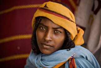 A woman awaits consultation at a health clinic run by the medical charity Médecins Sans Frontières (MSF) Holland in Kerfi, Chad, on June 10, 2008. 