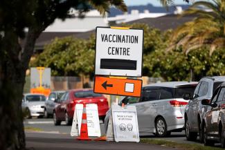 A vaccination center sign directs the public during a lockdown to curb the spread of a COVID-19 outbreak in Auckland, New Zealand, on August 26, 2021.