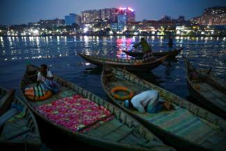 Along the banks of the Buriganga River, a Muslim boatman performs evening prayer in the holy fasting month of Ramadan, in Dhaka, Bangladesh, on May 1, 2021. 