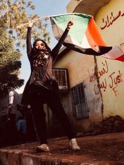 Physician Sarah Khalifa rotesting during first days of the December revolution in Khartoum district of Burri, in Sudan