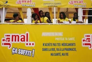 Girls stand in a truck during a campaign to raise awareness about illegal and false drugs in Abobo, a suburb of Abidjan, Ivory Coast, on October 11, 2018.
