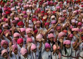 Girls wave as they take part in celebrations to mark the International Day of the Girl Child at a school in Chandigarh, India, on October 12, 2015. 