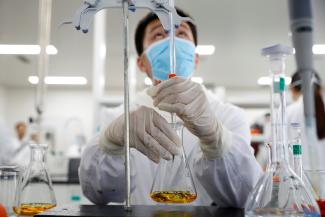 A man works in a laboratory of Chinese vaccine maker Sinovac Biotech, developing an experimental coronavirus disease (COVID-19) vaccine, during a government-organized media tour in Beijing, China, September 24, 2020.