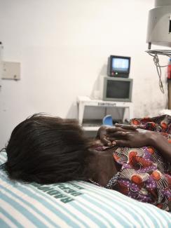 A 52-year-old woman suffering from bladder cancer lies under a radiotherapy simulator used to pinpoint areas to treat at the Korle Bu Teaching Hospital in Accra April 24, 2012.