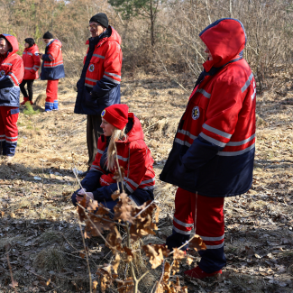 Ukrainian paramedics take cover in the woods as air raid sirens go off following a Russian attack on the Yavoriv military base, outside a hospital in Yavoriv, Ukraine, March 13, 2022. 