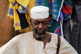 Boureima Dicko, 70, in a white hat and shirt, recently fled attacks by Islamist militants in northern Burkina Faso, a country in West Africa. He is pictured at a camp for internally displaced people in Ouagadougou, in central Burkina Faso, on January 29 , 2022. 