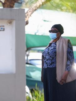 A woman stands at the entrance of Mediclinic in Sandton, South Africa, on August 4, 2022.