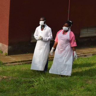 Dressed in long white aprons, two Ugandan medical staff members inspect the ebola preparedness facilities at Bwera General Hospital near Uganda’s border with the Democratic Republic of Congo, in Bwera, Uganda, on June 12, 2019. 