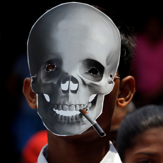 A child wears a skull mask at an anti-tobacco awareness rally on World No Tobacco Day in Kolkata, India, on May 31, 2019. REUTERS/Rupak De Chowdhuri