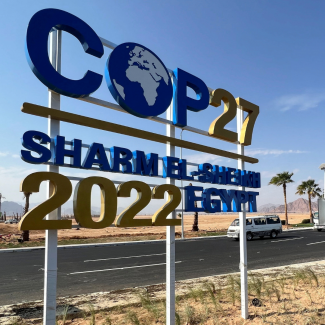 View of a COP27 sign on the road leading to the conference area in Egypt's Red Sea resort of Sharm el-Sheikh, host to the COP27 climate summit. Photo taken on October 20, 2022. 