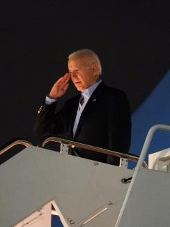 U.S. President Joe Biden salutes from Air Force One as he departs for Egypt to attend the COP27 summit from Joint Base Andrews in Maryland, on November 10, 2022.