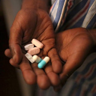 A closee-up of the palms of a nine-year-old holding antiretroviral (ARV) pills prescribed for HIV infection at Nkosi's Haven, in Johannesburg, South Africa.
