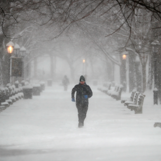 A man runs in Riverside Park during a winter storm on the upper west side of Manhattan in New York City, New York, U.S., February 1, 2021. REUTERS/Mike Segar
