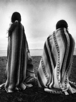 Weetoomoo Carey, 8, left, and her sister Jackolynn Carey, 5, Wampanoag Nipmucs from Mashpee, look across to the Mayflower replica anchored near Plymouth Rock in Plymouth, Mass. on Nov. 26, 1991.