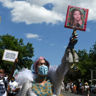 A participant holds up a picture of Layleen Polanco—a transgender person who died at Rikers Island prison—during a Black Trans Lives Matter rally in Brooklyn, New York, on June 14, 2020. 