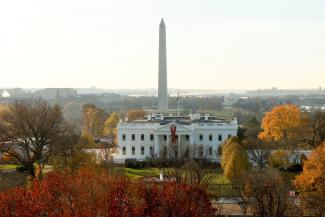 A red ribbon marks World AIDS Day on the North Portico of the White House, seen from the windows of a conference room where attendees gathered for a World AIDS Day event, in Washington, DC., on December 2, 2022. 