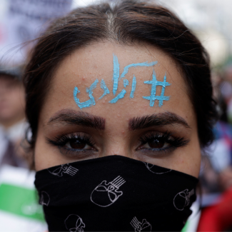 A protester with the words "Freedom" written on her forehead following the death of Mahsa Amini, near the Iranian consulate in Istanbul, Turkey, on October 4, 2022. 
