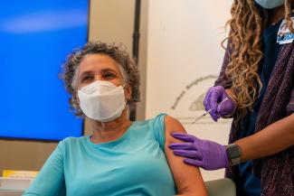 Mary Bassett, commissioner of the Department of Health and Mental Hygiene, receives an omicron bivalent booster shot, during a press conference update on COVID-19, in New York City, on September 7, 2022.