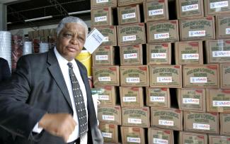 U.S. ambassador to Zimbabwe James Mcgee walks pasts cholera kits at a UNICEF warehouse in Harare, Zimbabwe, on January 29, 2009.