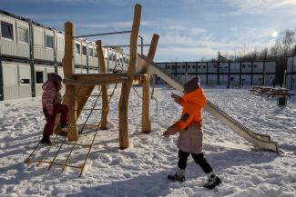 Children from Donbas play near modular houses donated by the Polish government for Ukrainian internally displaced persons in Lviv, Ukraine, on February 9, 2023, amid Russia's attack on Ukraine. 